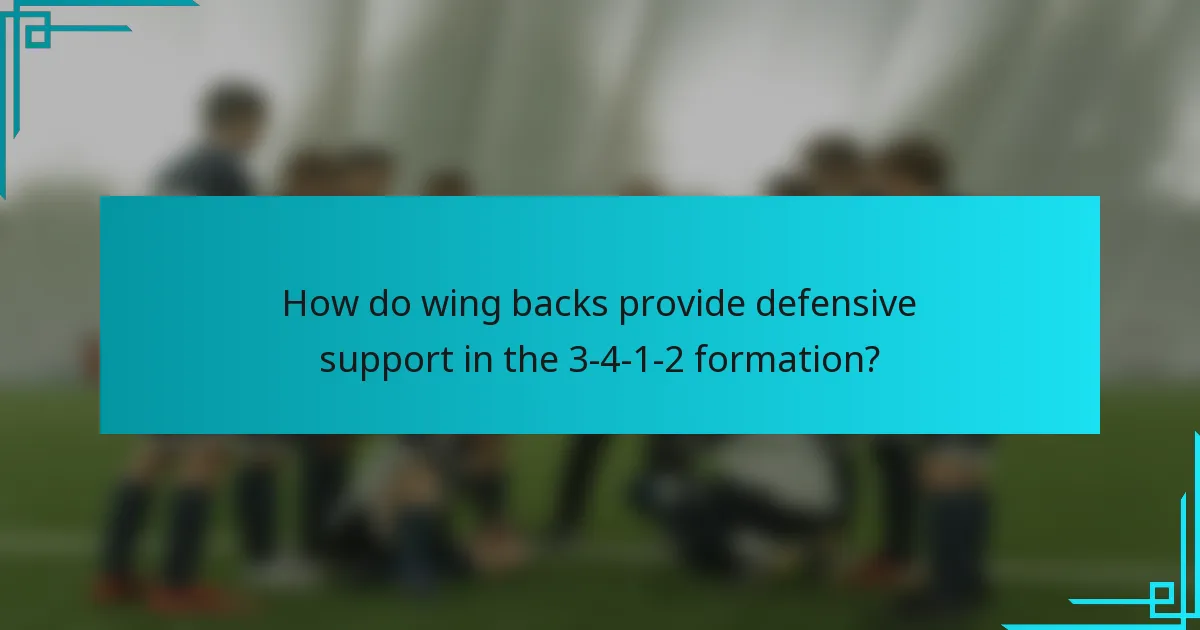 How do wing backs provide defensive support in the 3-4-1-2 formation?