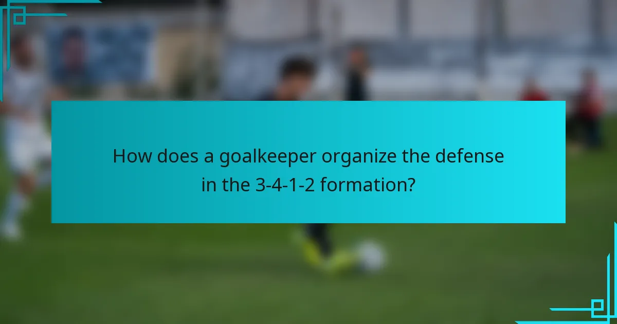How does a goalkeeper organize the defense in the 3-4-1-2 formation?